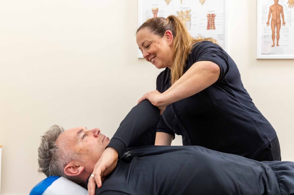 Chiropractor Treating a Patient's Elbow in Sale
