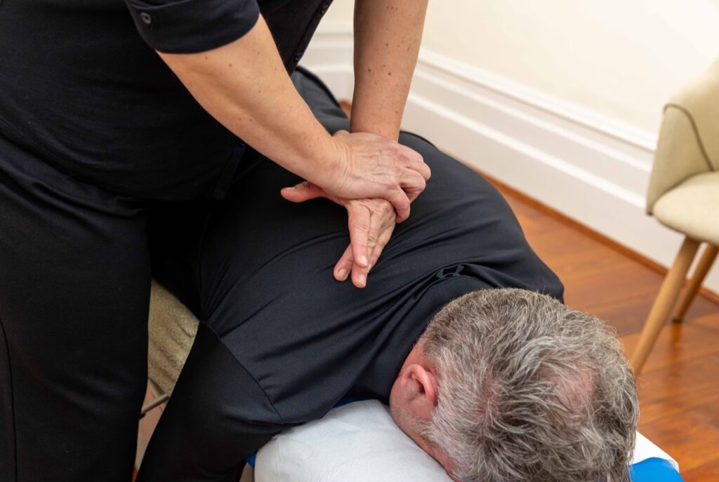 Chiropractor Treating a Patient in Sale