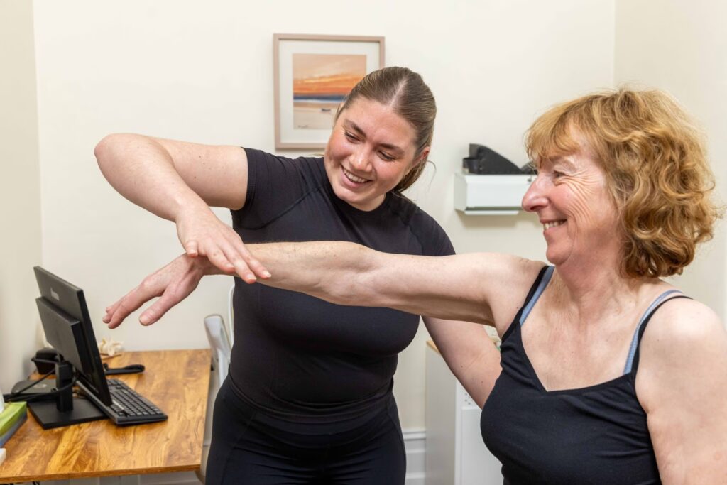 Sale Physiotherapist Treating a Patient's Arm